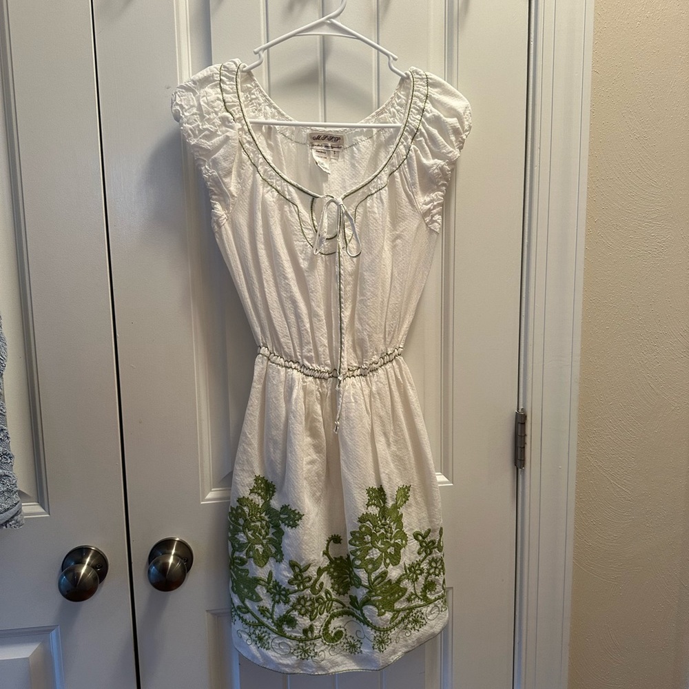White dress with beautiful green embroidery